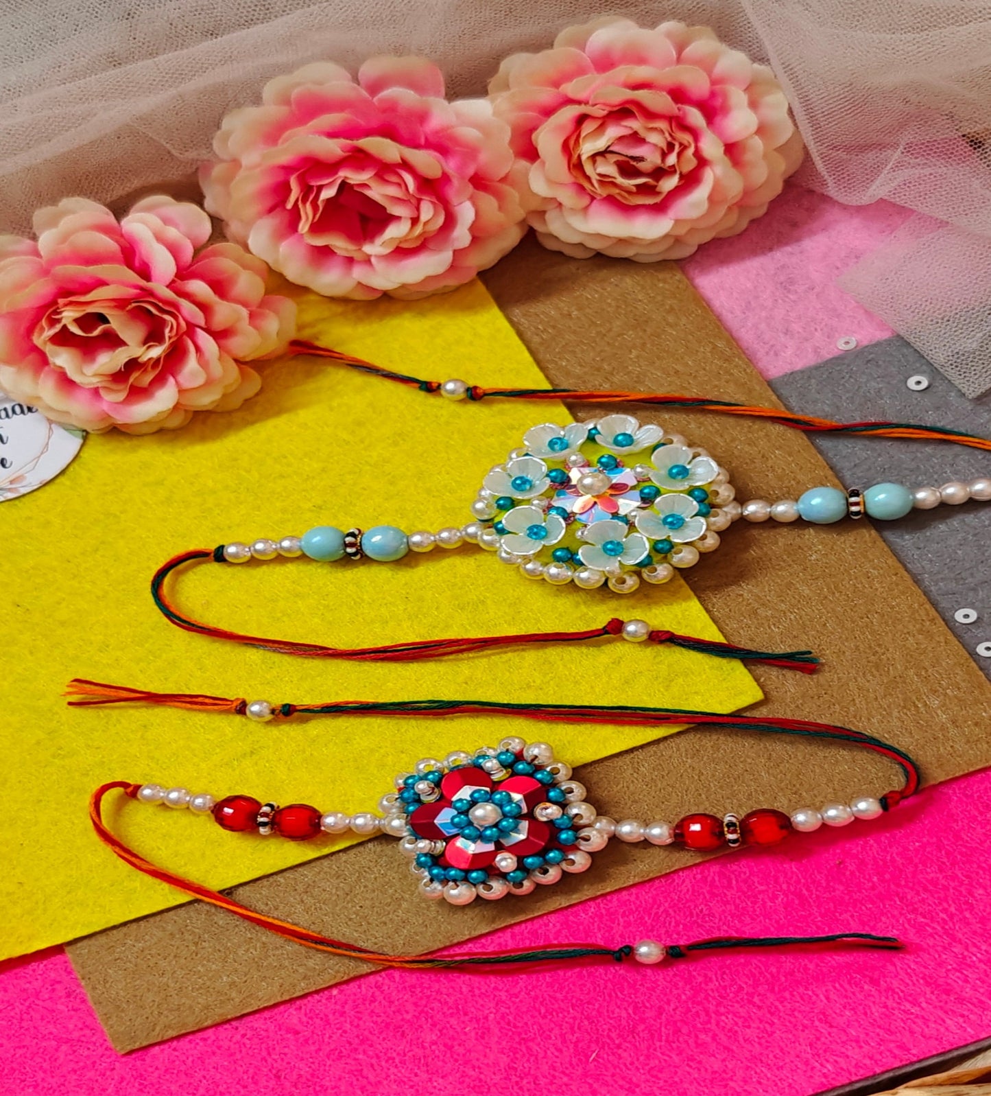 FLOWER SEQUENCE BEADED RAKHI - COMBO (PINK, BLUE, WHITE & RED)