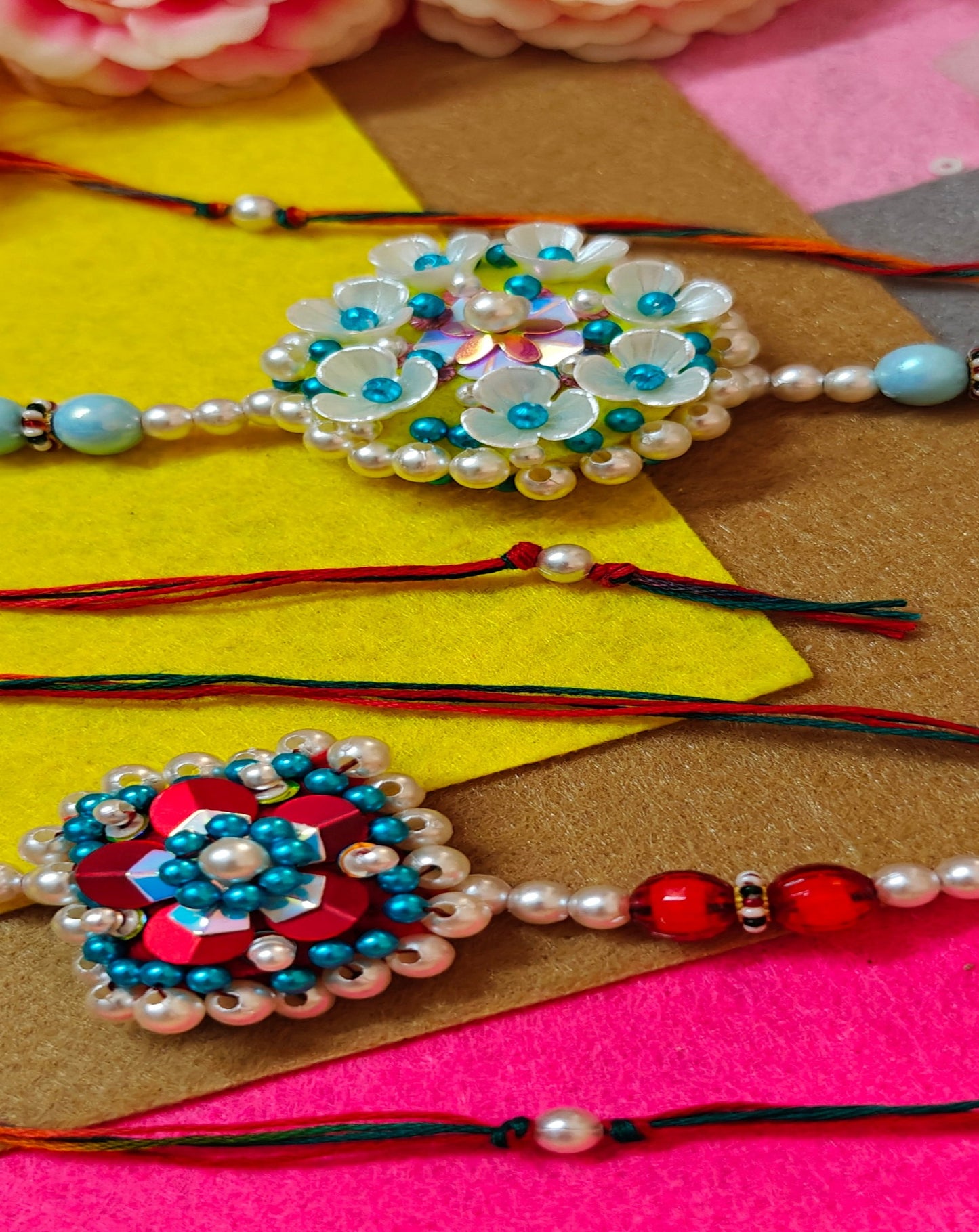 FLOWER SEQUENCE BEADED RAKHI - COMBO (PINK, BLUE, WHITE & RED)